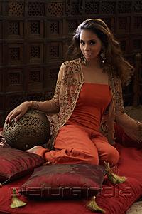 PictureIndia - Indian woman sitting on pillows