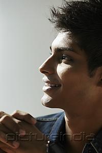 PictureIndia - head shot of young man in profile