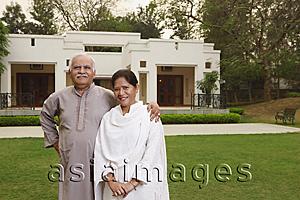 Asia Images Group - senior couple in front of home