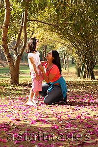 Asia Images Group - Mother and daughter in grove of trees