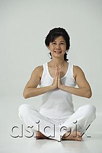 AsiaPix - Woman sitting in yoga posture