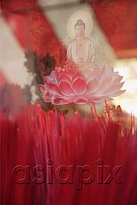 AsiaPix - Close up of incense sticks and Buddha in lotus flower