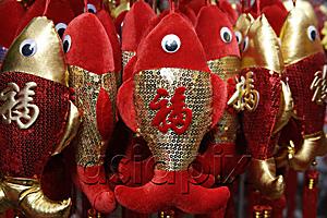 AsiaPix - Still life of hanging decorations of fish with Chinese character for 
