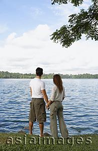 Asia Images Group - Couple holding hands looking at lake