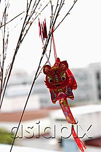 AsiaPix - Chinese dragon decoration hanging from branch