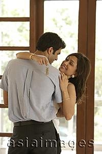 Asia Images Group - couple embraced, woman with set of keys