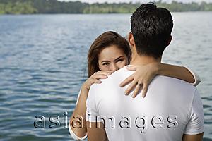 Asia Images Group - Couple embracing near lake