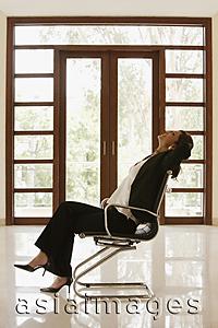 Asia Images Group - woman in empty office or home