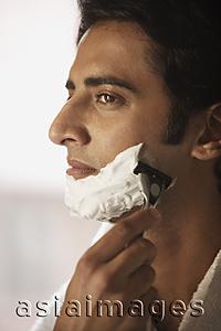 Asia Images Group - Man shaving his face