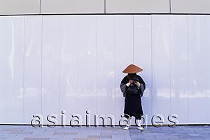 Asia Images Group - Japan,Tokyo,Ginza,Monk Collecting Alms