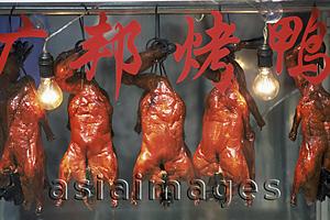Asia Images Group - China,Shanghai,Roast Duck Hanging in Restaurant Window
