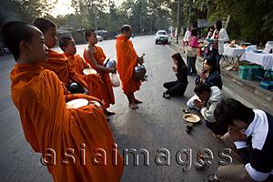 Asia Images Group - Thailand,Chiang Mai,Monks Receiving Offerings of Food