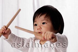 Asia Images Group - Chinese baby holding drum sticks