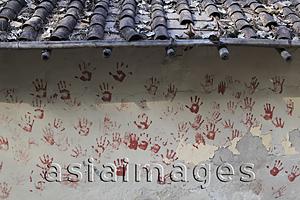 Asia Images Group - Red hand prints on side of village wall. New Delhi, India