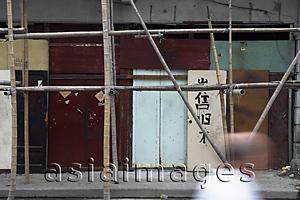 Asia Images Group - Old wall made of doors in Shanghai with bamboo scaffolding
