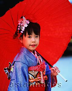 Asia Images Group - Japan, Shichi-Go-San festival, girl wearing a kimono holding an umbrella