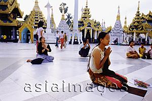 Asia Images Group - Myanmar (Burma), Yangon (Rangoon), People praying at the Shwedagon Pagoda.