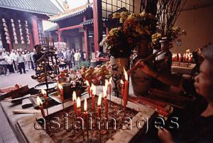Asia Images Group - Malaysia, Kuala Lumpur, Chinatown, Man praying at Chinese Temple.