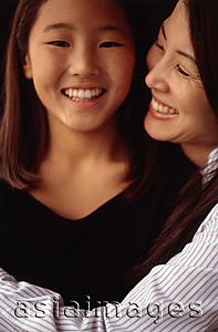Asia Images Group - Mother and daughter hugging and smiling