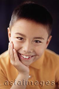 Asia Images Group - Boy with hand on chin