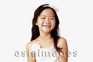 Asia Images Group - Girl in white dress smiling, portrait.