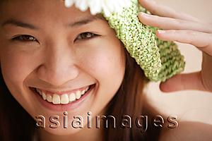 Asia Images Group - Young woman looking at camera, wearing hat