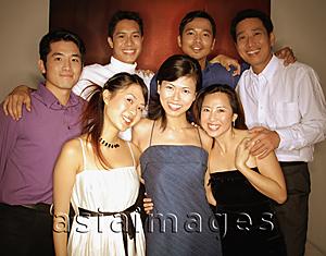 Asia Images Group - Group of friends posing for a picture, looking at camera