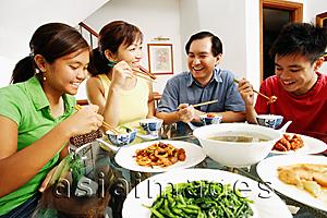 Asia Images Group - Family eating dinner at home