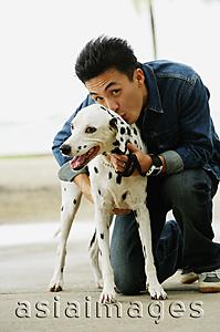 Asia Images Group - Man with Dalmatian dog, smiling at camera