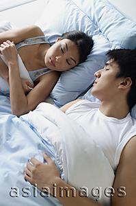 Asia Images Group - Couple sleeping side by side