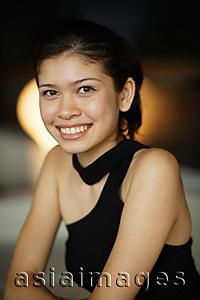 Asia Images Group - Young woman smiling at camera, portrait