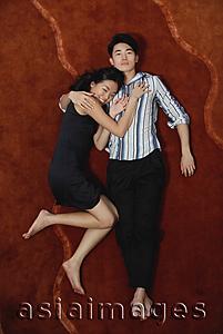 Asia Images Group - Couple lying on floor, high angle view