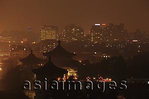 Asia Images Group - View of Beijing city scape at night with pagodas in foreground,China