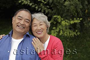 Asia Images Group - Older couple smiling togther outdoors