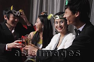 Asia Images Group - Two couples celebrating at a party together