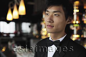 Asia Images Group - Head shot of young man wearing a tuxedo