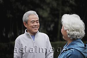 Asia Images Group - A senior man talking to a senior woman