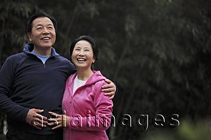 Asia Images Group - Senior couple embracing and laughing
