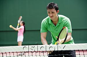 AsiaPix - Couple playing tennis