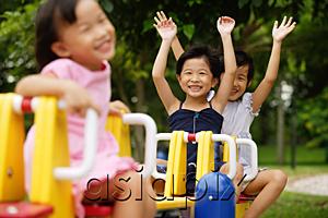 AsiaPix - Three girls on a seesaw, arms outstretched
