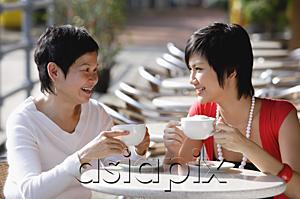AsiaPix - Two women in cafe having a drink