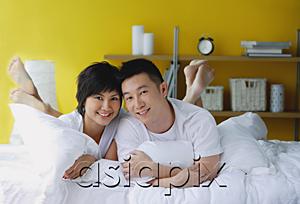 AsiaPix - Couple lying on bed, portrait