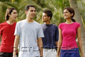 PictureIndia - Young adults walking in park