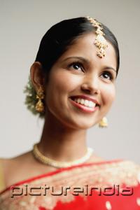 PictureIndia - Portrait of woman in Indian sari, smiling